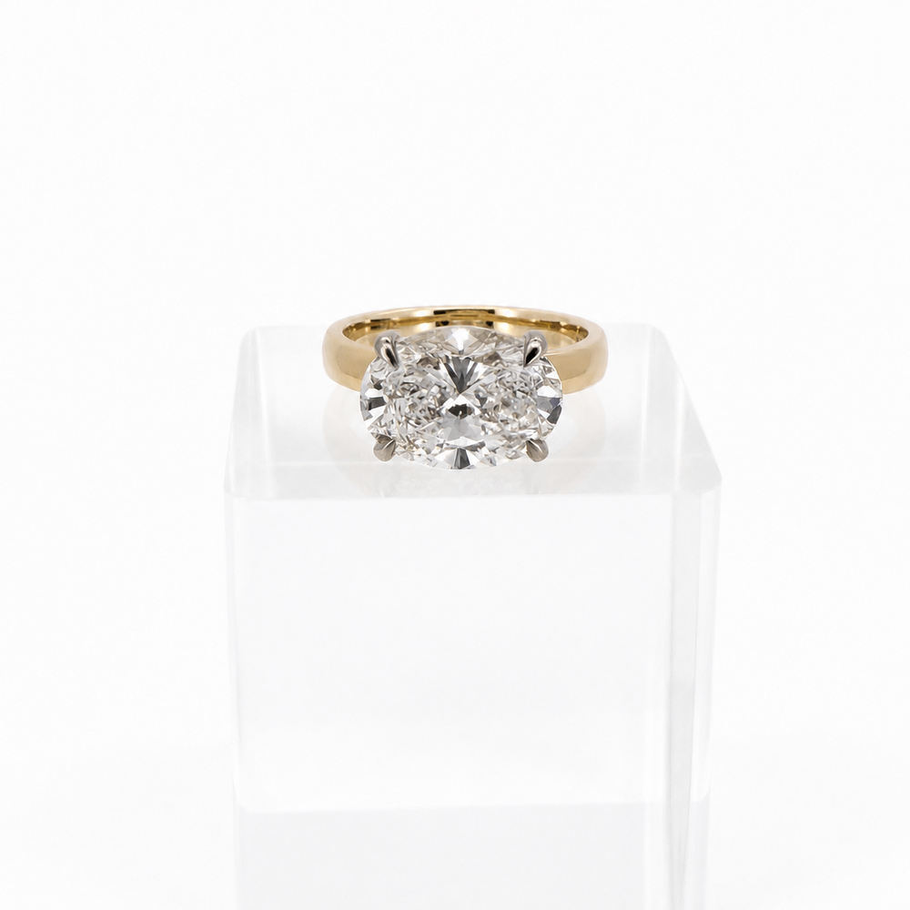 Custom 4.01ct D VVS2 oval diamond ring in 14K yellow gold with platinum prongs, front view